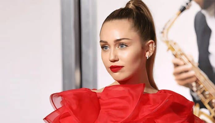 Celebrity in a glamorous red dress symbolizing high-profile cases, reflecting public attention on the Listeria ice cream lawsuit and the Miley Cyrus Flowers lawsuit.