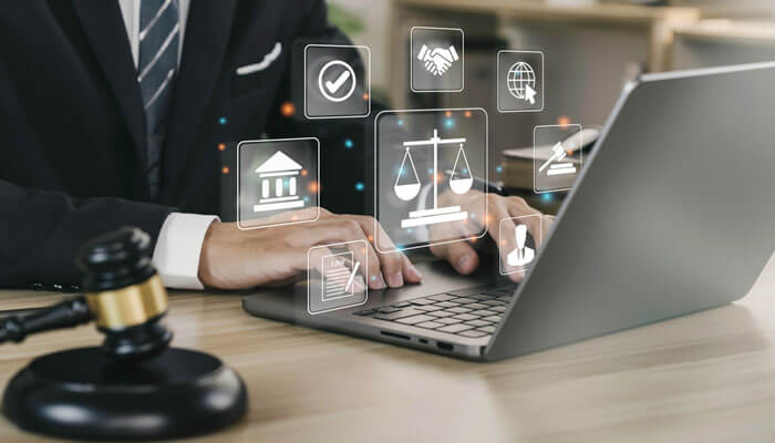 Lawyer working on a laptop with digital icons representing legal processes, including scales of justice, a courthouse, and legal agreements, in the context of a generational equity lawsuit.