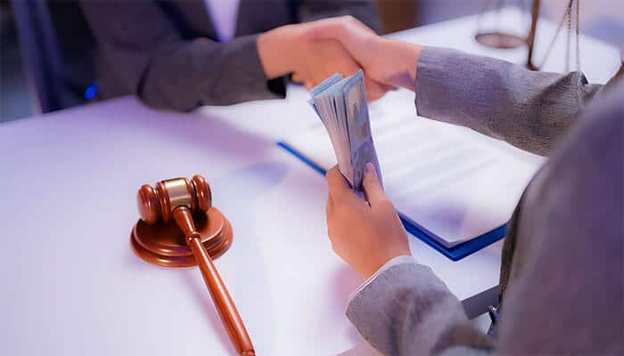 Lawyer handing settlement money during a legal case, representing compensation claims in the Listeria ice cream lawsuit.