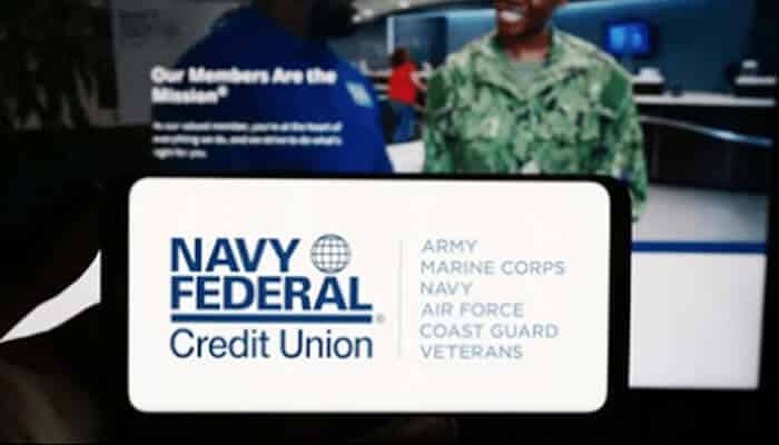 Navy Federal Credit Union logo on a screen with military service members in the background, highlighting issues linked to the Navy Federal lawsuit.