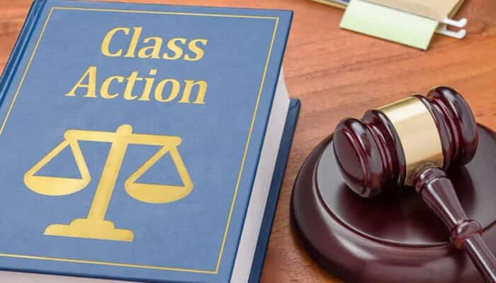 Class Action lawsuit book and judge’s gavel on a desk, symbolizing legal action and investor claims in the PNC Retirement Account Cash Sweep Lawsuit.