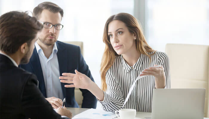 Sandstone Law Group attorneys consulting with clients on insurance claim denials, providing legal guidance and strategy to secure rightful benefits.