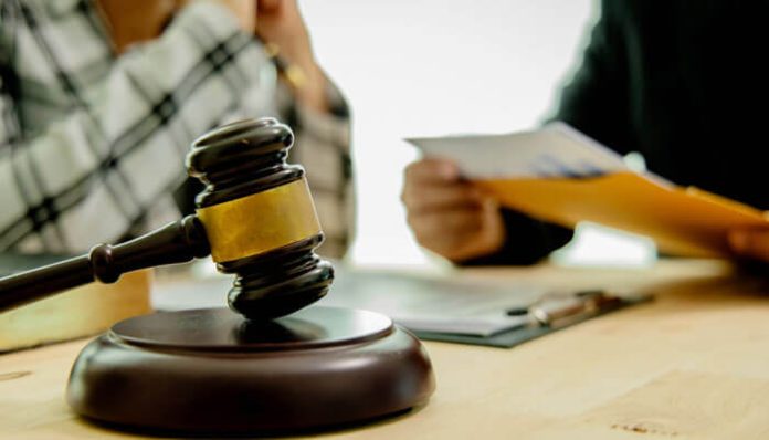 Alabama License Defense Lawyer meeting with client to protect professional license and career