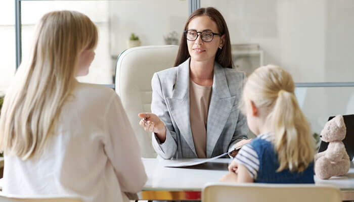 Family meeting with adoption lawyer to discuss the legal process of adopting a child in Florida.