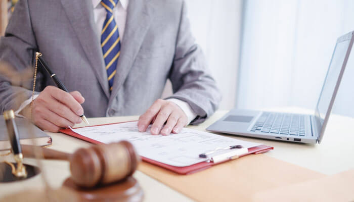 Lawyer preparing legal documents for filing a CTE lawsuit in a personal injury case.