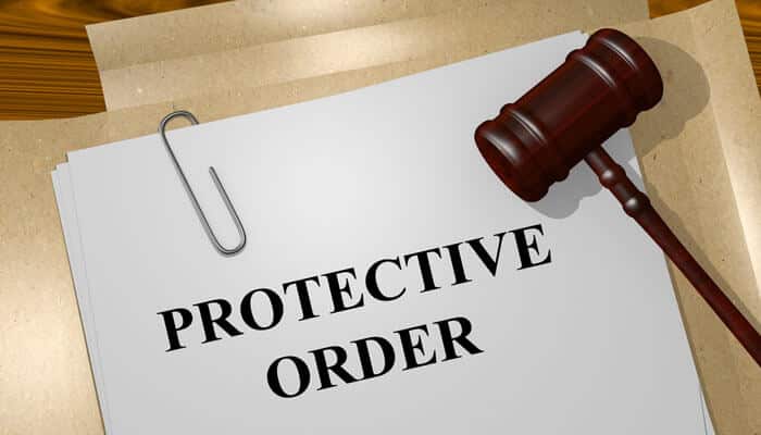 Gavel on protective order document showing how restraining orders affect custody in Domestic Violence Charges in Florida.