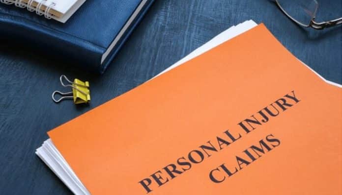 Legal documents labeled Personal Injury Claims placed on a desk, representing different types of personal injury cases and compensation rights.