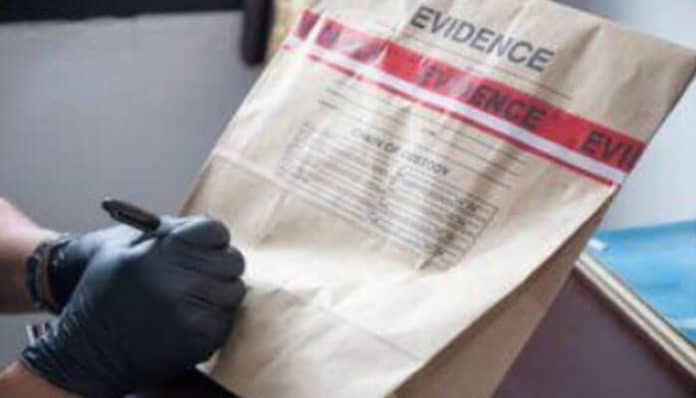 Evidence bag being labeled by an investigator to document proof for a Truck Accident Claim case.