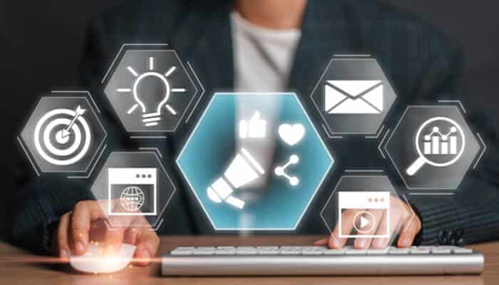 A person working on a keyboard surrounded by digital marketing icons such as analytics, email, targeting, and social media, representing Future-Proof Advertising Strategies.