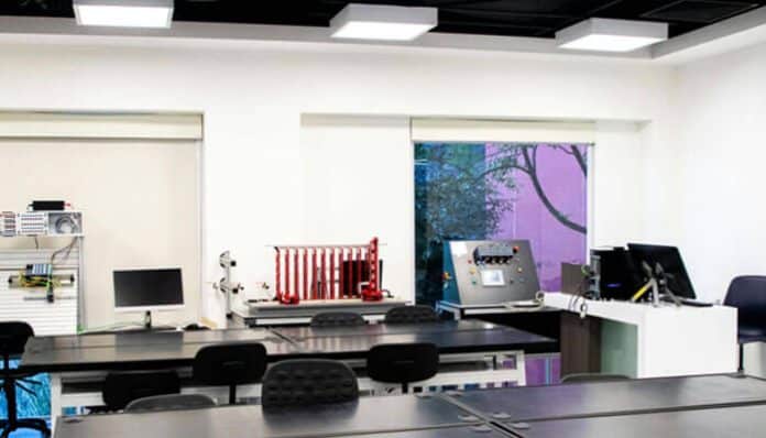 A modern research lab setup, featuring various equipment on workstations, emphasizing the environment where human error can occur in research labs.
