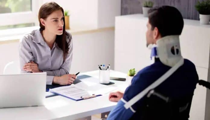Injured individual consulting a legal professional, highlighting legal support for injury victims during recovery and claims discussions.