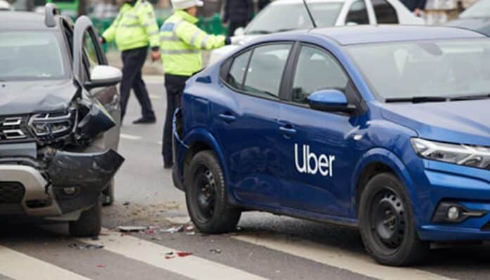 Police officers at the scene of an Uber vehicle collision illustrating Uber And Lyft Accident Claims involving rideshare insurance and liability.