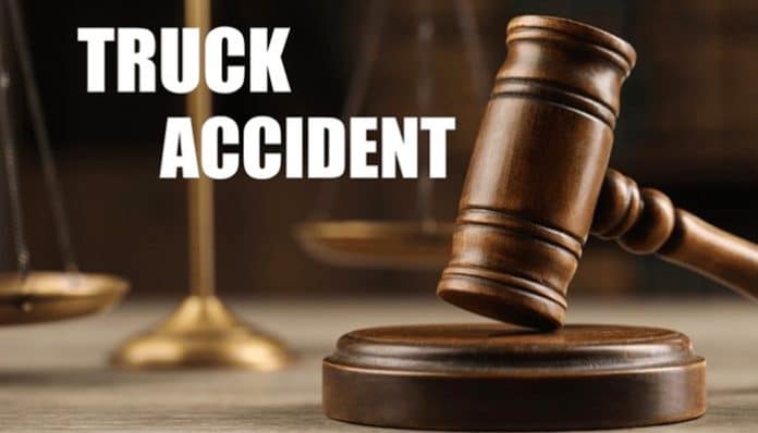 Truck Accident Lawyer concept with gavel and scales of justice for legal representation.