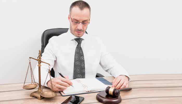 Personal injury lawyer reviewing case files when injuries occur on tribal land and involve complex legal issues.