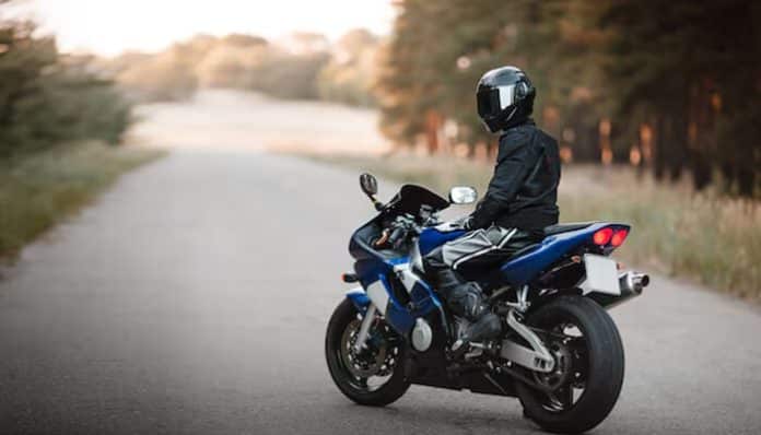 Motorcycle Owner in East Texas riding a sport bike on a quiet rural road, highlighting safe riding and asset protection awareness.
