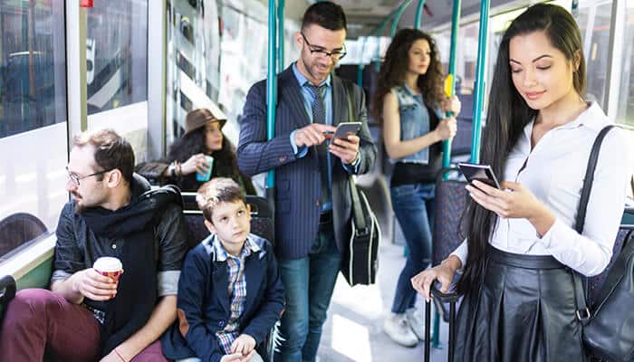 Non-Collision Bus Injuries risk shown by standing and seated passengers inside a crowded bus during routine transit travel.