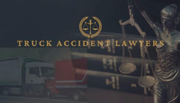 Truck Accident Lawyer graphic showing legal scales and commercial trucks in the background.