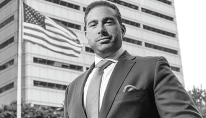 Attorney Lawrence Kajy, Michigan personal injury lawyer, standing confidently outside a courthouse representing accident victims.