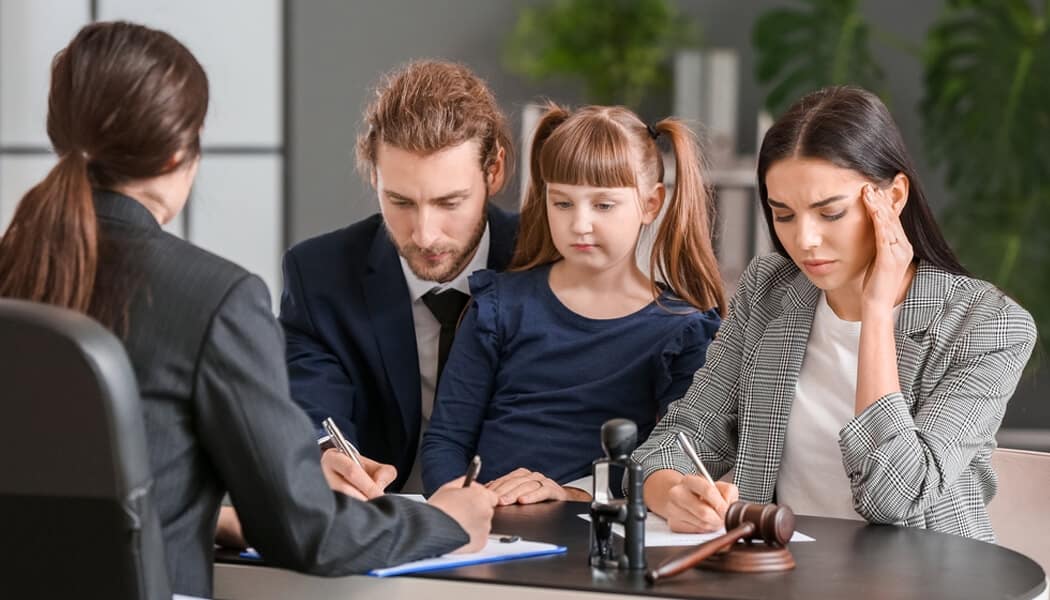 Child Custody Lawyer - mylegalopinion - My Legal Opinion A family consulting with a lawyer in a legal setting, highlighting types of lawyers and the role of family lawyers in divorce and child custody cases.