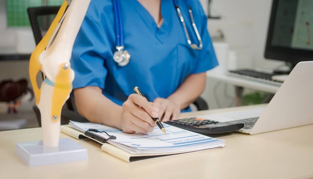 Document Your Injuries and Expenses - Mylegalopinion - My Legal Opinion Doctor writing on a medical chart, illustrating the importance of seeking medical help after injuries caused by Crash Diets and Dizzy Treadmills or Weight-Loss Plans that lead to falls.