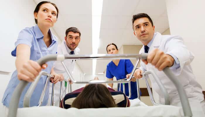 ER Error Lawsuit - Mylegalopinion - My Legal Opinion Doctors and nurses assisting a patient in critical condition, an incident that could result in an Emergency Room Error Lawsuit due to medical negligence.