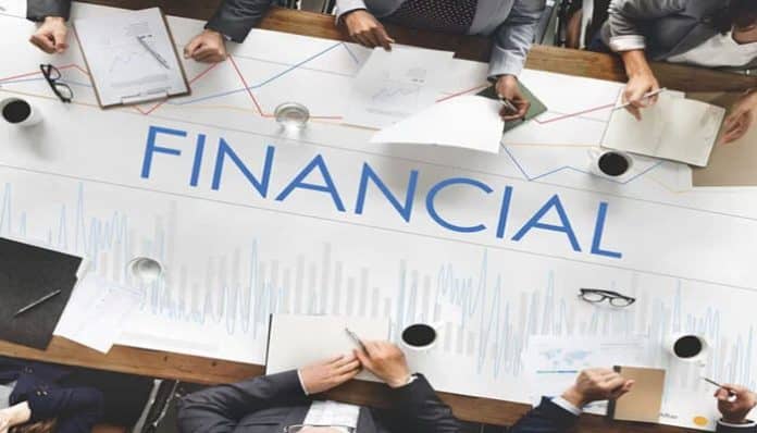 Non-Economic Losses and Financial Impact illustrated by professionals reviewing financial documents during a legal or compensation assessment meeting