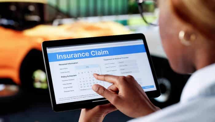 Filing the Insurance Claim - mylegalopinion - My Legal Opinion Phoenix Personal Injury Attorney assisting with an insurance claim process using digital documentation after an accident.
