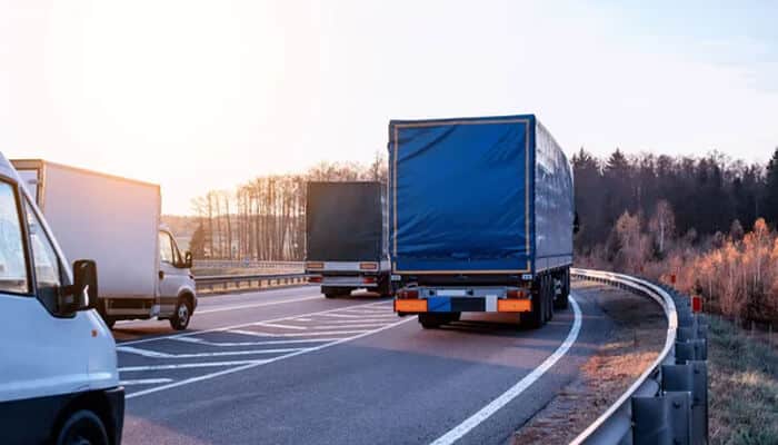 Key Ohio Commercial Trucking Laws You Should Know - Mylegalopinion - My Legal Opinion Traffic scene showing multiple trucks on a highway, highlighting safety risks addressed under Ohio Commercial Trucking Laws.