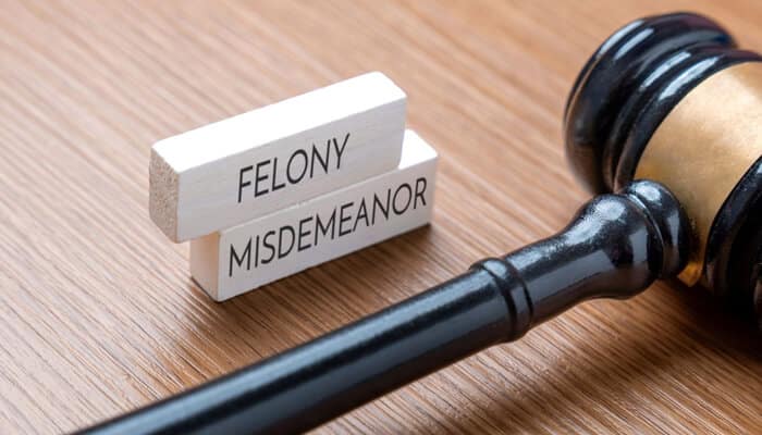 Post-Conviction Considerations - myleagalopinion - My Legal Opinion Gavel and legal blocks labeled felony and misdemeanor, illustrating how misdemeanor charges are classified in criminal law.
