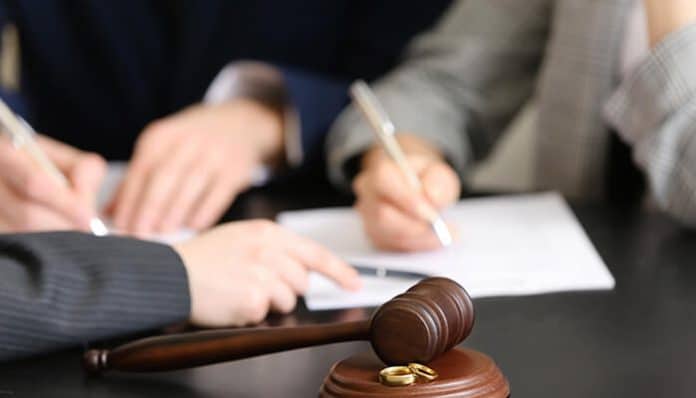 Attorneys reviewing legal documents during divorce discovery proceedings