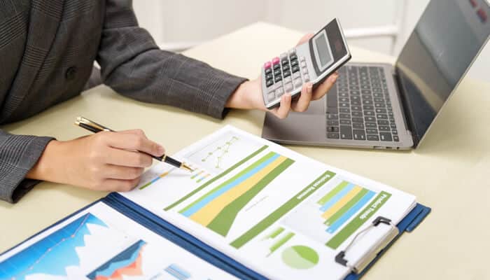 What Forensic Accounting Actually Involves - mylegalopinion - My Legal Opinion Forensic accounting professional reviewing financial charts and calculations for detailed analysis