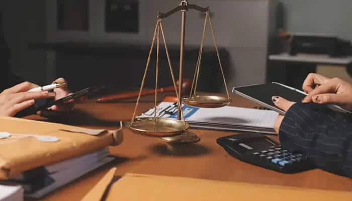 When A Drug Charge Becomes A Felony Understanding Possession vs Distribution Under California Law - mylegalopinion - My Legal Opinion Legal documents and scales of justice symbolizing court decisions related to Possession vs Distribution Under California Law.