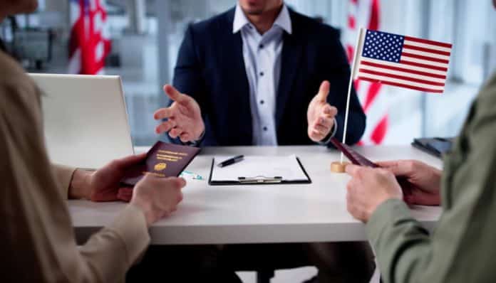 Immigration consultation during spouses ICE detention, with U.S. flag visible.