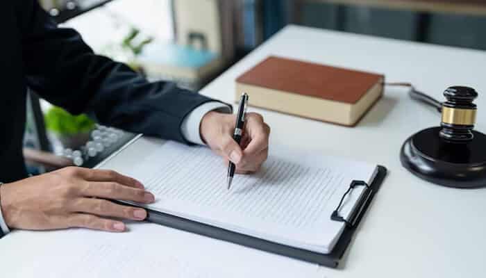 Why Documentation Is A Financial Tool Not Just A Legal One - My Legal Opinion - My Legal Opinion Lawyer reviewing documents related to a motorcycle accident injury claim and financial recovery process