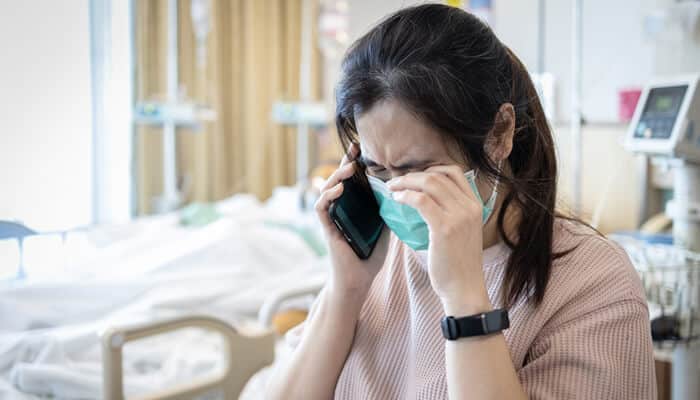 Why Undisclosed Risks Matter After a Death - Mylegalopinion - My Legal Opinion Informed Consent Failures in Wrongful Death Cases depicting a grieving family member in a hospital room following a fatal medical procedure