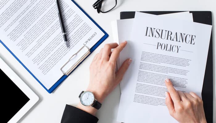 Your Insurance Policy The Most Reliable Path to Compensation - Mylegalopinin - My Legal Opinion Reviewing an insurance policy document to understand options after a car accident with no insurance