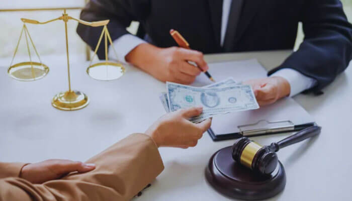 Can I sue for sexual assault?- Mylegalopnion - My Legal Opinion Do I Need Criminal Charges to File a Lawsuit? An image showing a legal transaction with a person handing money to a lawyer, with a gavel and scales of justice in the background, representing the legal process of suing for sexual assault.