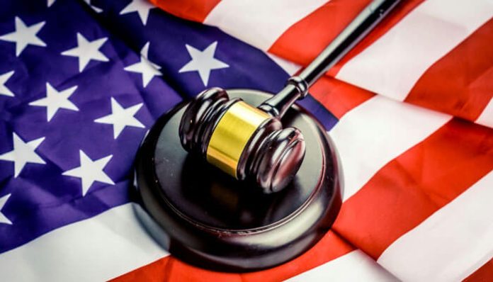Federal Crimes Lawyer - Gavel resting on the American flag, symbolizing justice in federal criminal cases.