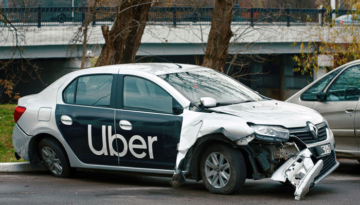 The Three Tiers of Rideshare Insurance - My Legal Opinion - My Legal Opinion A damaged Uber vehicle after an accident, showing the specific complexities involved in Uber rideshare accidents. A specialized Las Vegas Uber accident lawyer vs. a regular car accident lawyer is essential for these cases.
