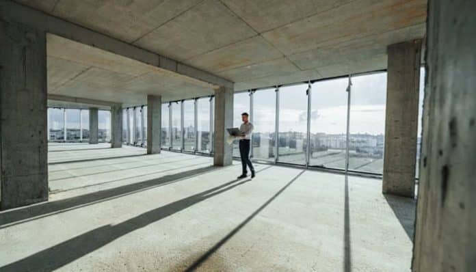 Commercial Real Estate Restructurings image showing an empty unfinished office space prepared for redevelopment or adaptive reuse.
