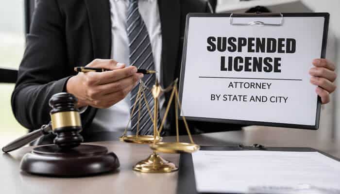Suspended License Attorney By State and City - My Legal Opinion - My Legal Opinion Suspended License Attorney presenting a document, highlighting legal support for fighting license suspension by state and city. Legal expertise in handling DMV hearings and reinstatement processes.