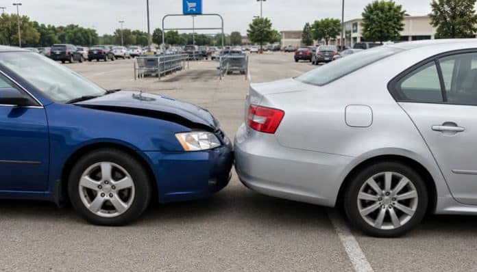Parking Lot Accidents showing two cars in a minor rear-end collision in a busy parking area.
